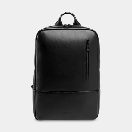 Nordweg Nomad leather laptop backpack in black, front view with vertical zip pocket