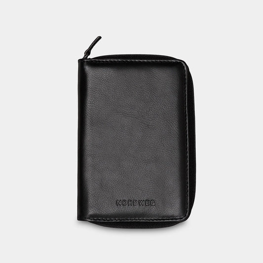 Nordweg Nomad leather passport wallet in black, front view with zip-around closure