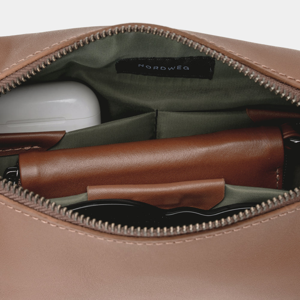 Pulse Leather Sling Bag in Caramel, organized interior