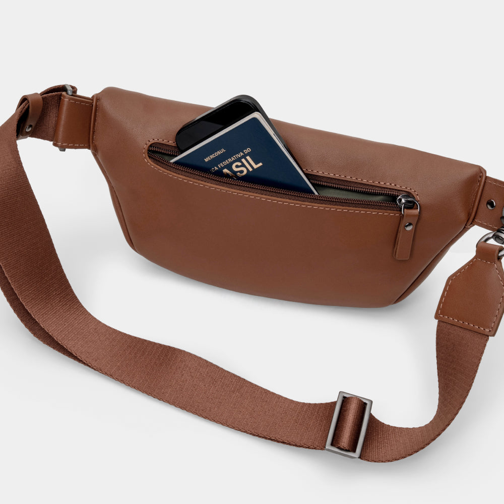 Pulse Leather Sling Bag in Caramel, rear pocket in use