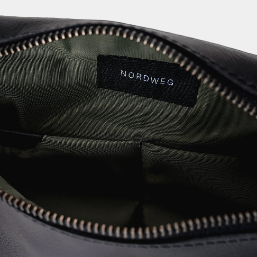 Pulse Leather Sling Bag in Black, organized interior