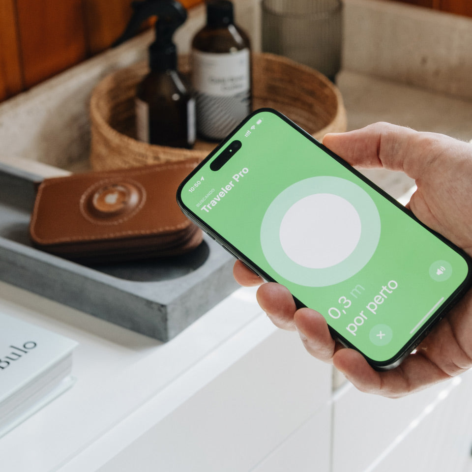 Person holding a smartphone with a green app interface in a bathroom setting