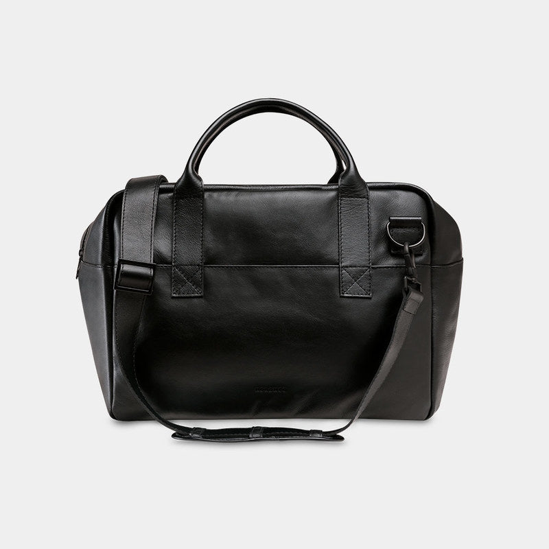 Nordweg Nomad leather weekender duffel bag in black, front view with handles and shoulder strap
