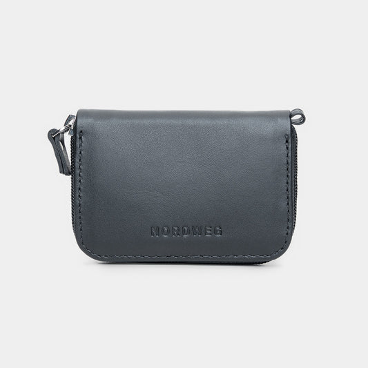 Nordweg Traveler Pro leather zip wallet in black, front view with wrist strap